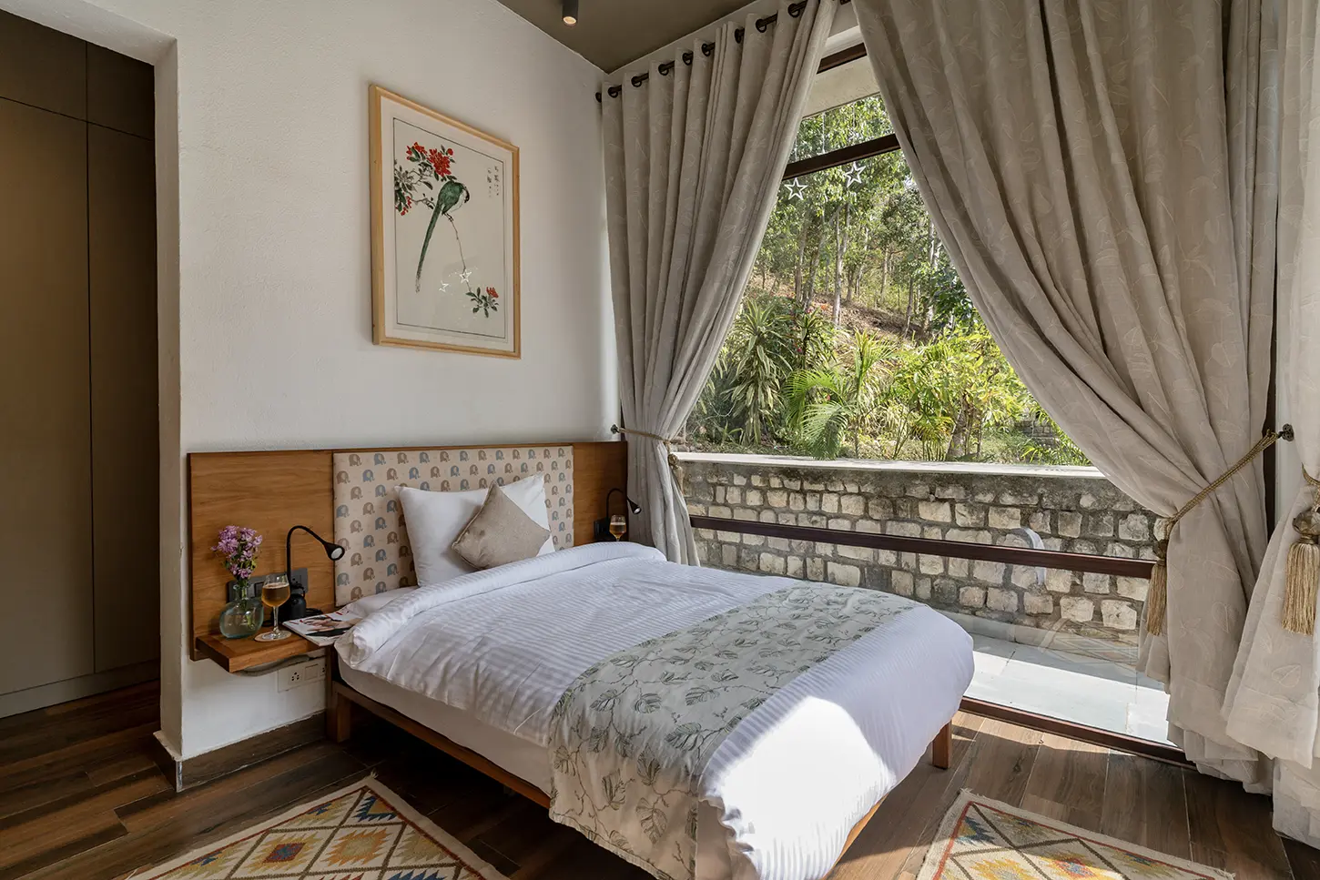 Bedroom at The Foresterie opening to forest views